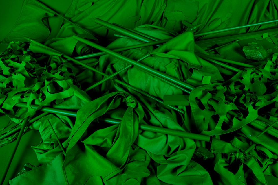 Photograph of protest props, fabricated entirely in bright green chroma key color.