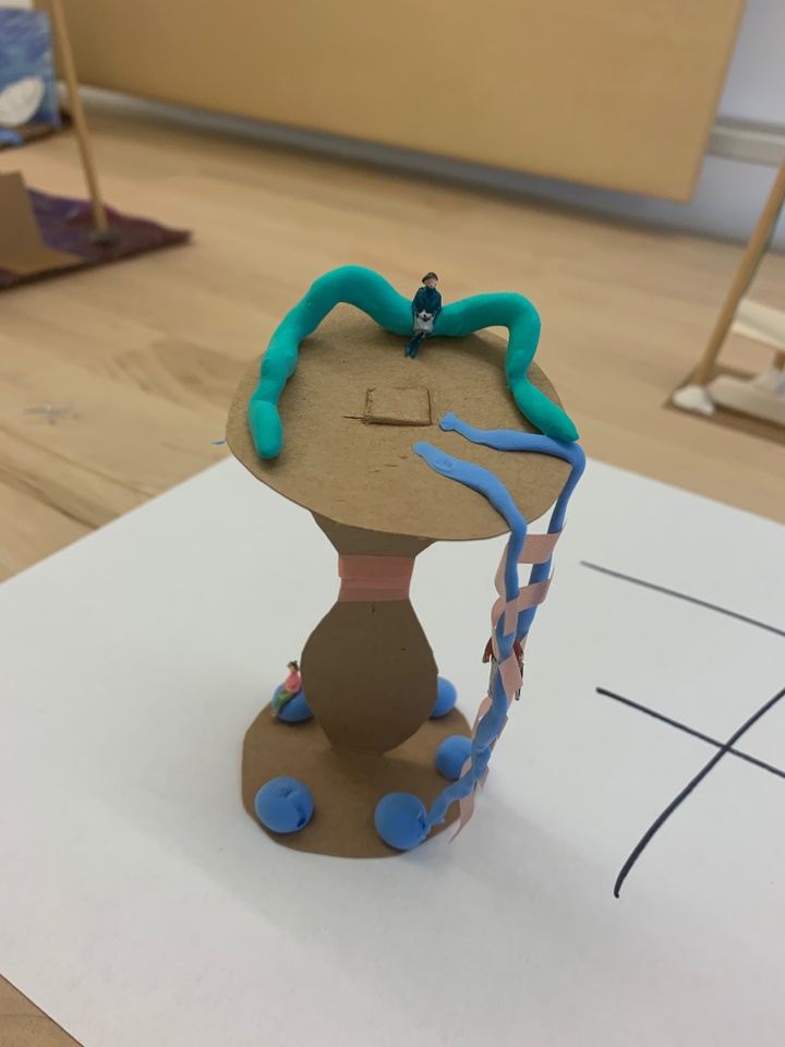 A model made out of cardboard, clay, and other materials.