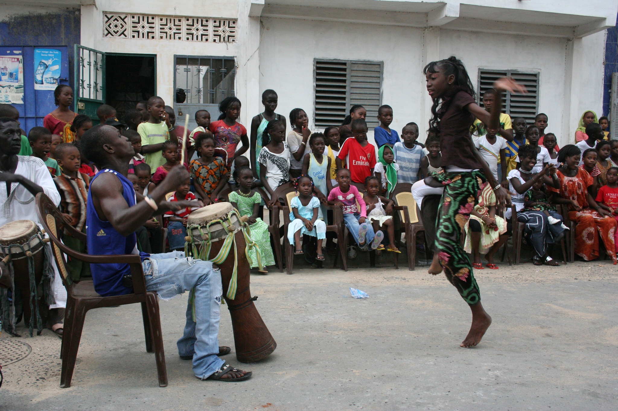 A dancer performs at a sabar bëcëg in the community of Medina, Dakar, Senegal