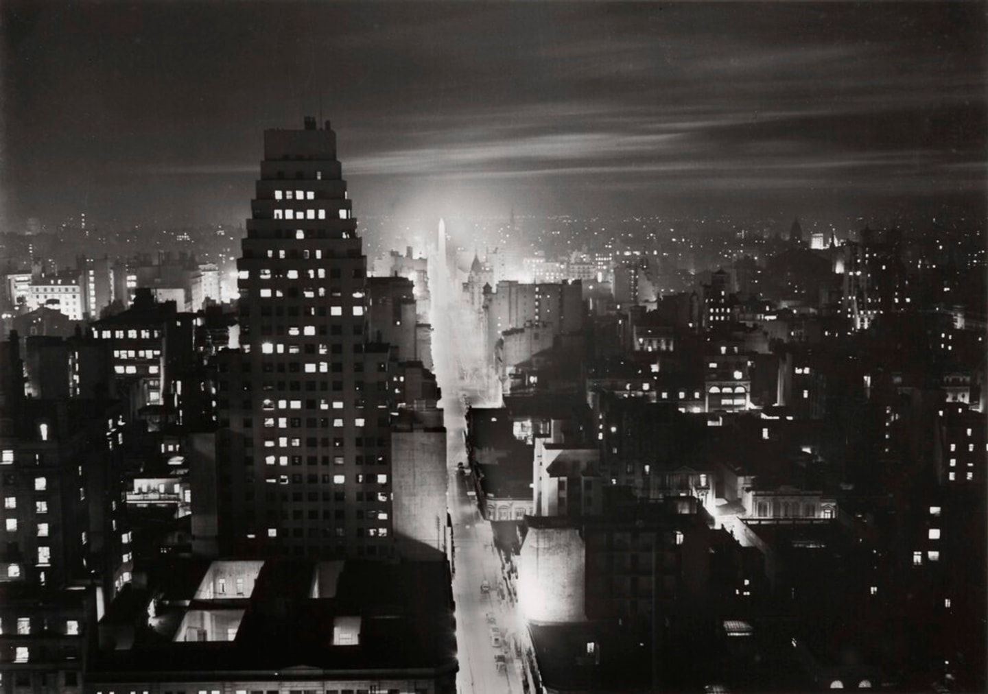 black and white image of a city at night
