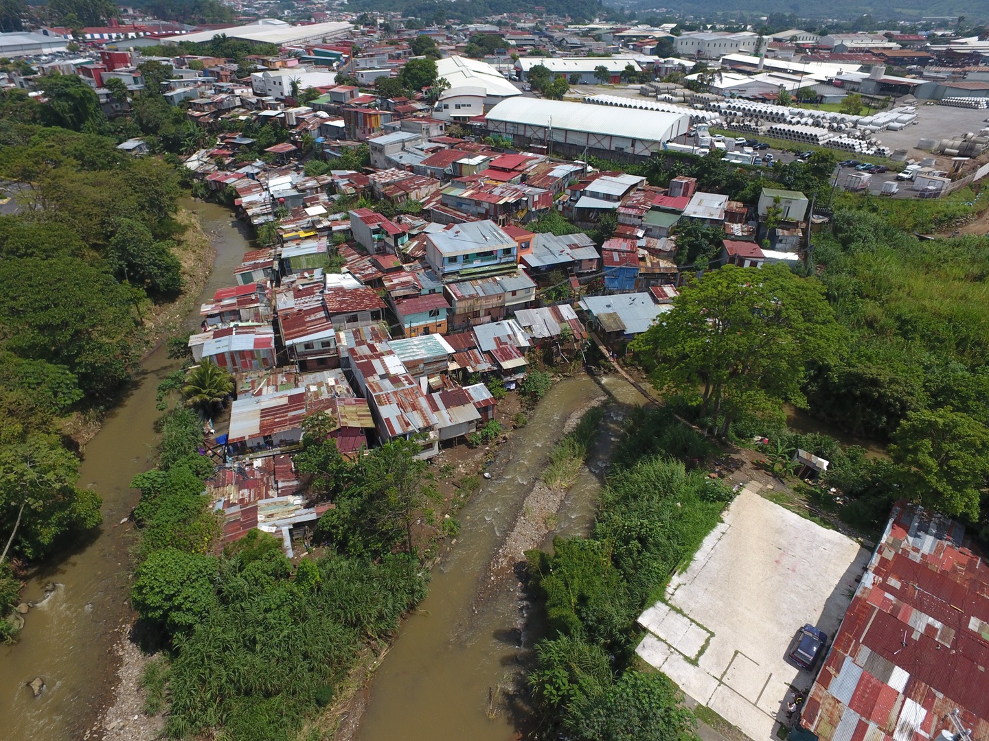 Birds eye view of a small village between two rivers