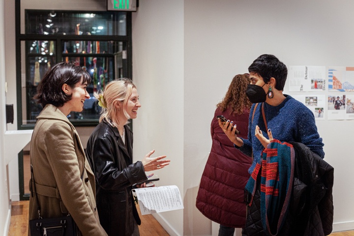 Visitors conversing in the gallery