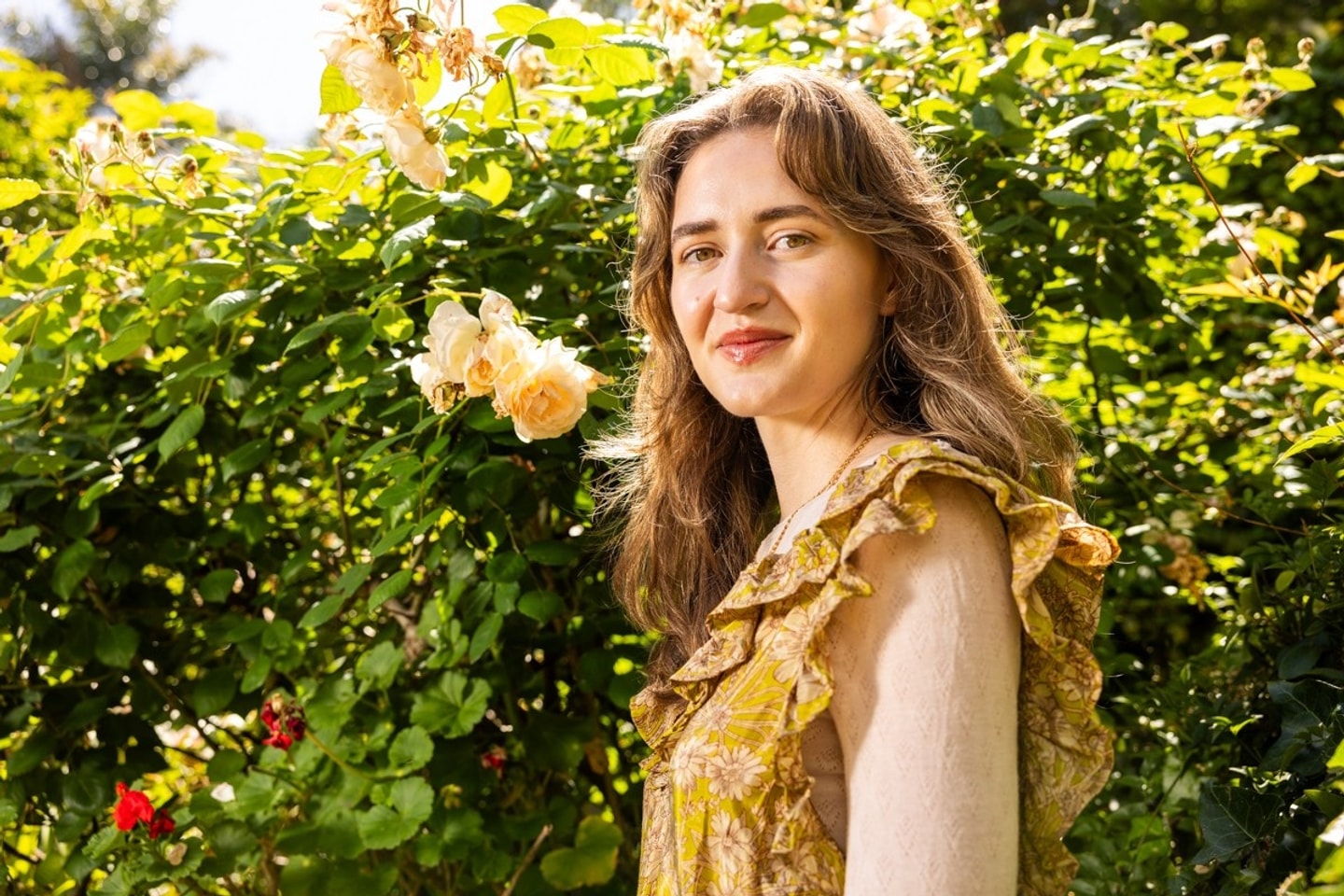 portrait of Olivia Baba in a yellow dress