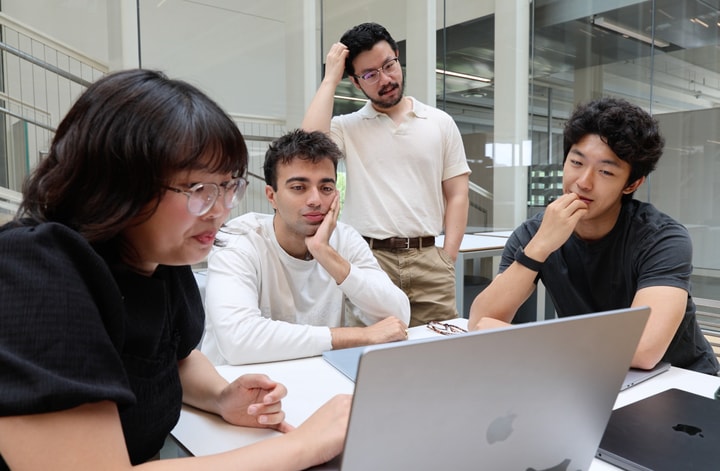group sitting at a table working together