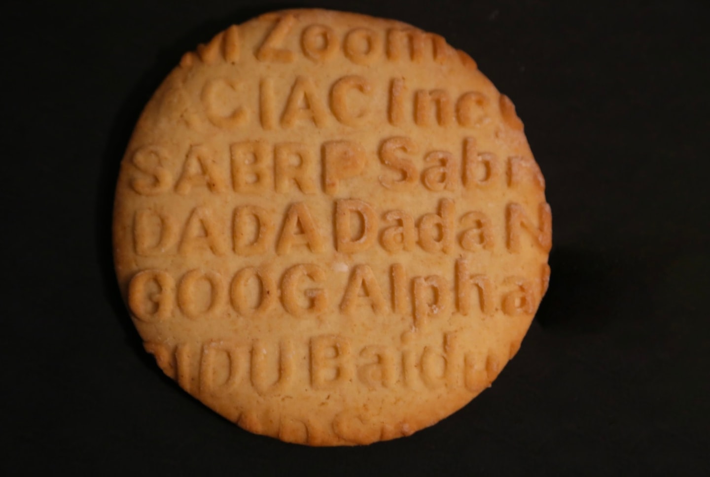 a cookie with embossed text