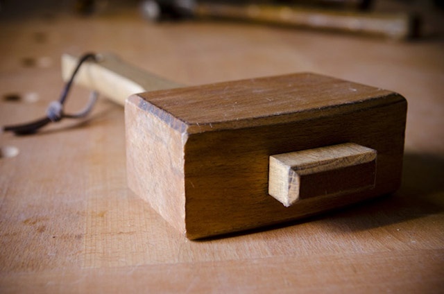 Photo of a mallet lying on a table.