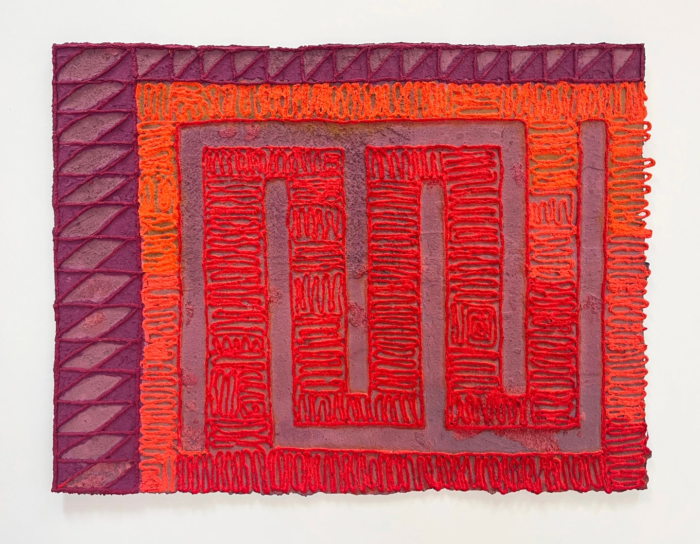 geometric patterns in reds and oranges